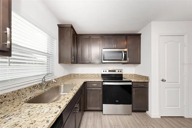 a bathroom with a bathtub and a sink