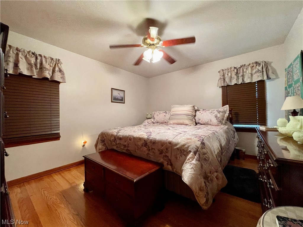 66119 Highway 124 Reedsville, OH 45772 - Photo 10 of 29 Hardwood floored bedroom featuring ceiling fan
