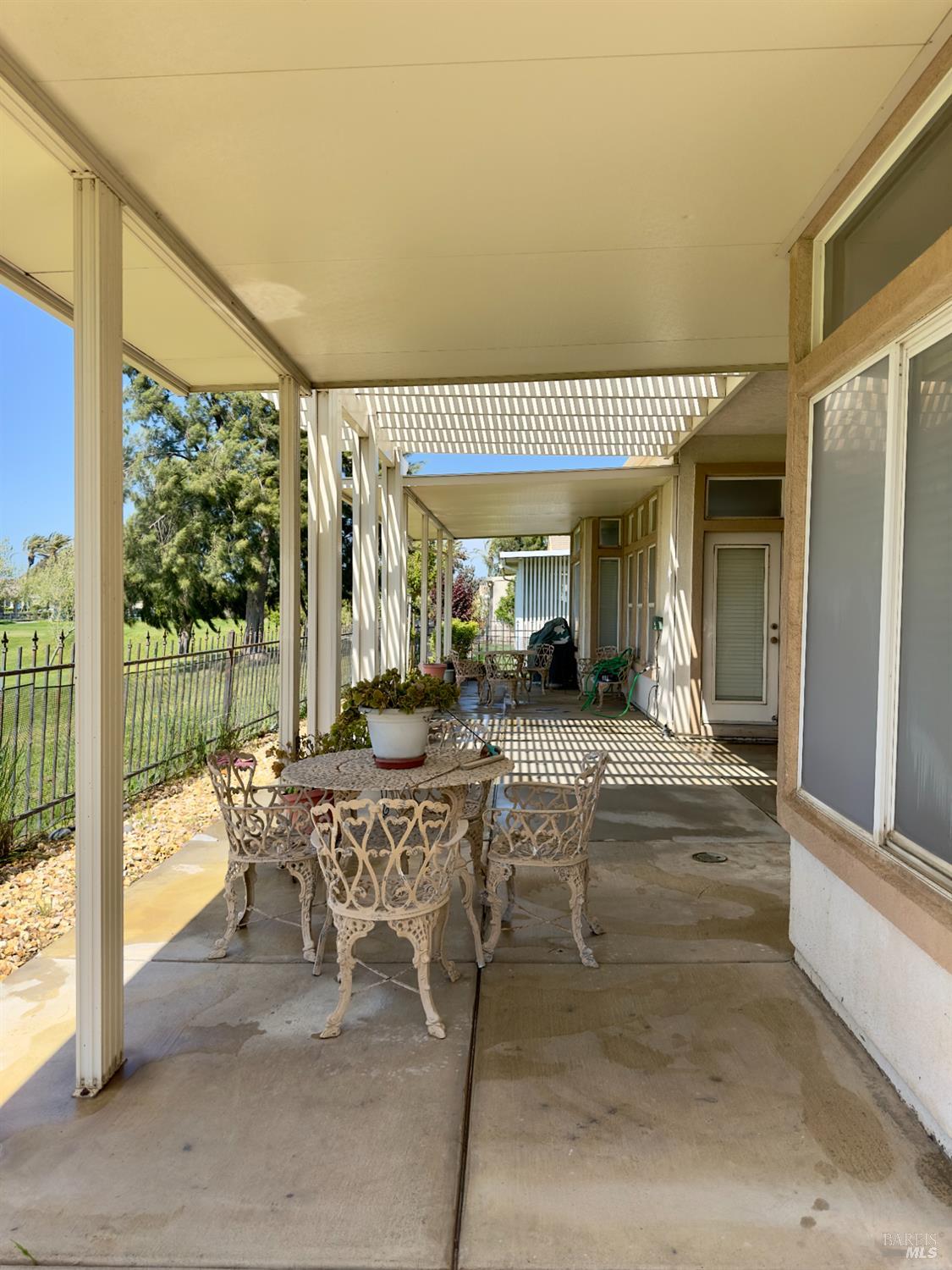 1074 Waterwood Drive Rio Vista, CA 94571 - Photo 6 of 7 a view of a patio with table and chairs and potted plants