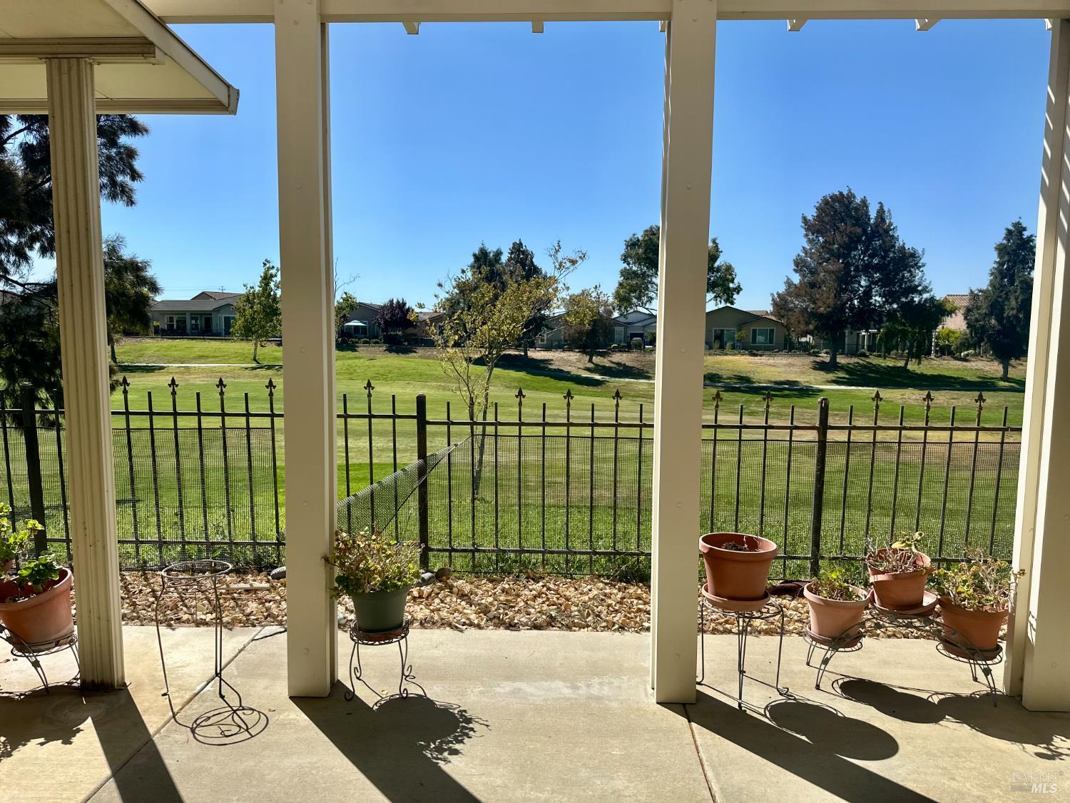 1074 Waterwood Drive Rio Vista, CA 94571 - Photo 7 of 7 a view of a deck with a floor to ceiling window next to a yard