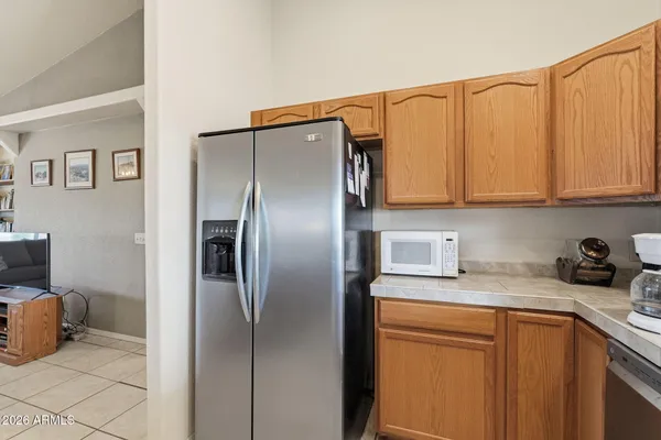 a kitchen with stainless steel appliances a stove a sink and a microwave