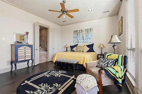 a bed room with two bed and a lamp