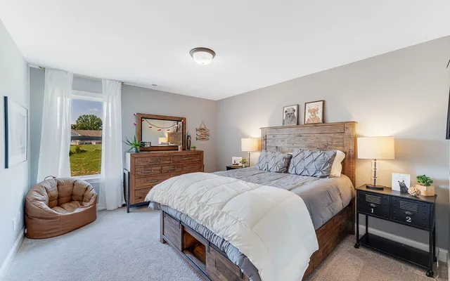 a bedroom with a bed and a couch