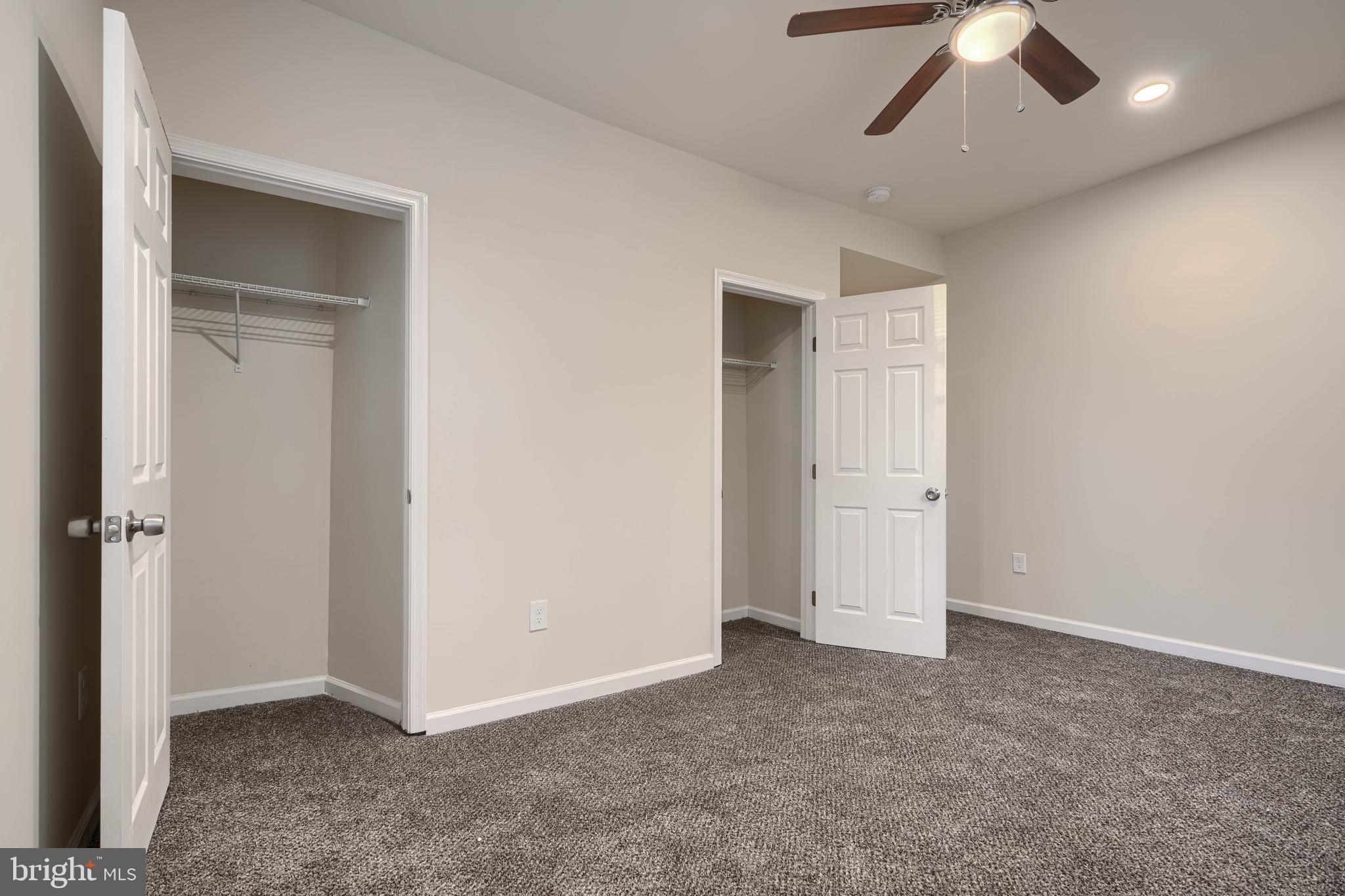 3308 Walbrook Avenue Baltimore, MD 21216 - Photo 17 of 32 an empty room with a empty space and a ceiling fan