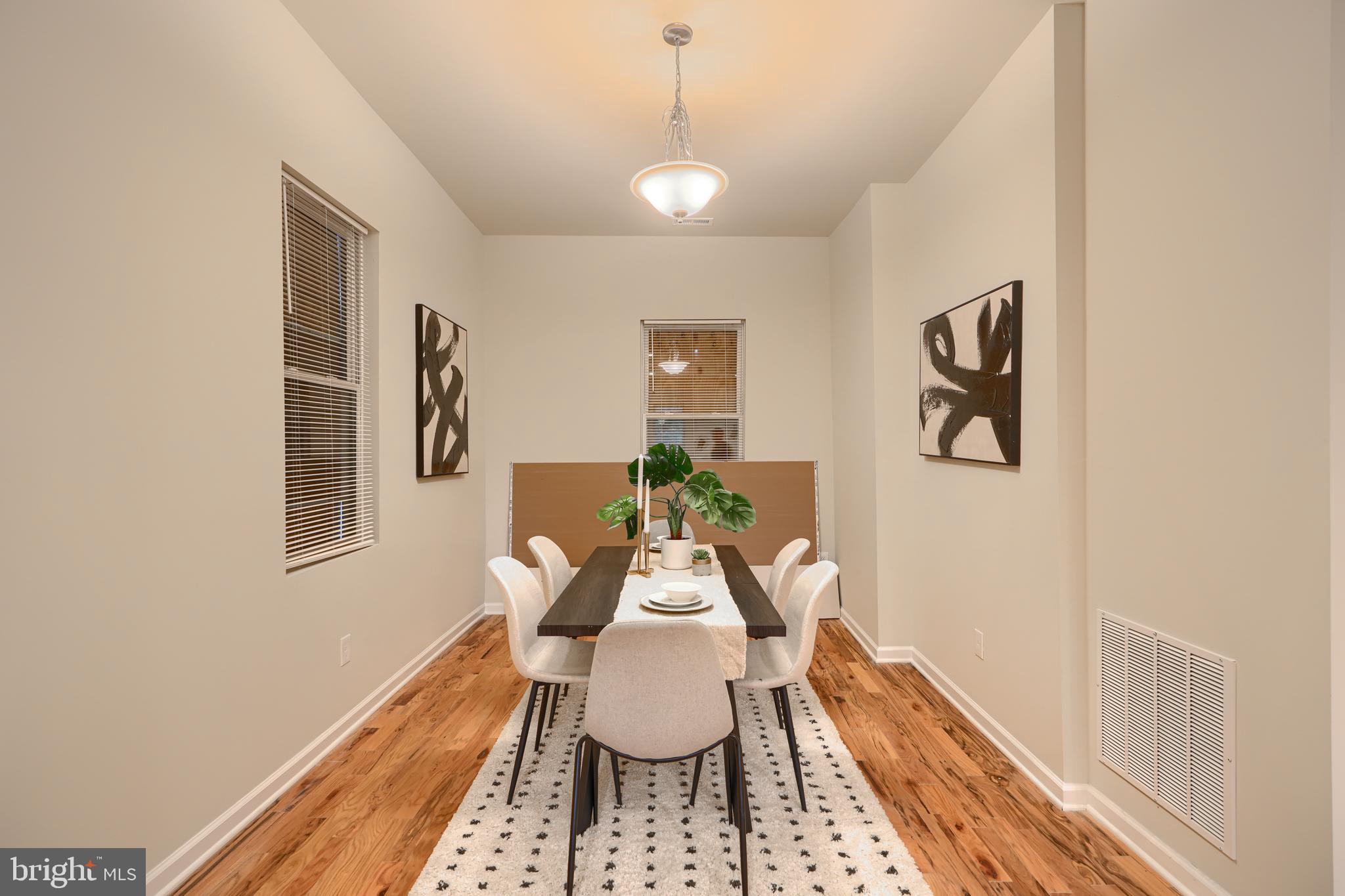 3308 Walbrook Avenue Baltimore, MD 21216 - Photo 4 of 32 a dining room with furniture and window