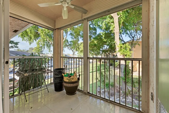a view of a house with swimming pool and sitting area