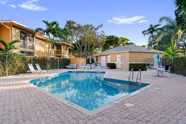 a view of swimming pool with outdoor seating