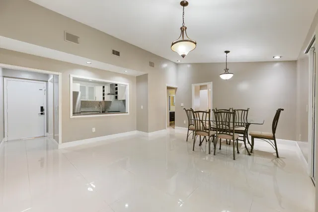 a view of a livingroom with furniture and a chandelier