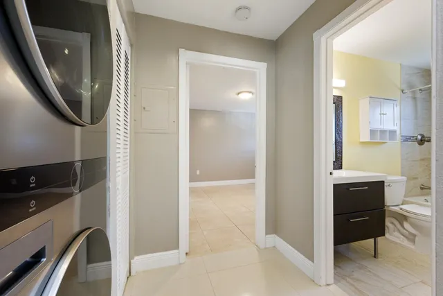 a view of a hallway with washer and dryer