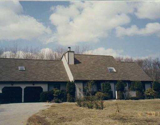 56 Town Farm Road New Milford, CT 06776 - Photo 1 of 1 a front view of a house with a garden