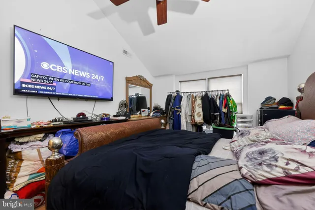 a bed room with a bed and a walk in closet