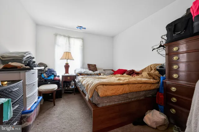 a bedroom with a bed and a tv