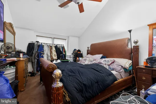 a bedroom with bed and a closet