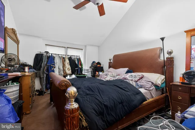 a bedroom with bed and a closet