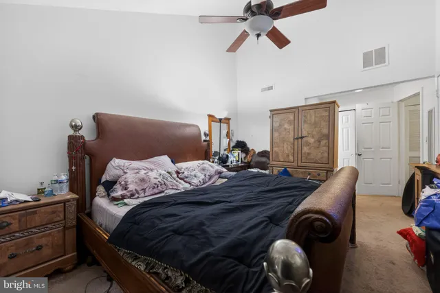 a bed room with a bed and a window