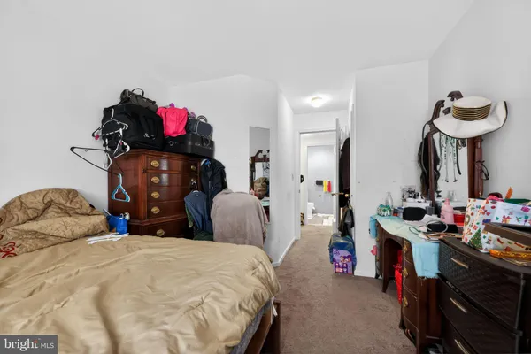 a bedroom with bed and a closet
