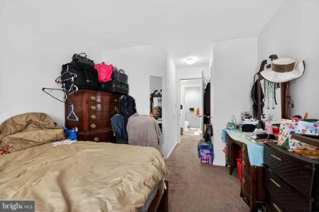a bedroom with bed and a closet