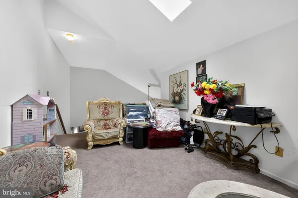 a bed room with furniture and a flat screen tv
