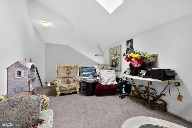 a bed room with furniture and a flat screen tv