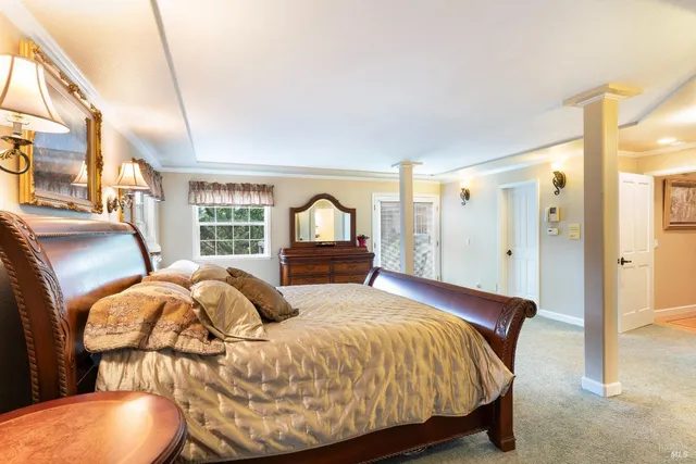 a view of an empty room with a fireplace and a window