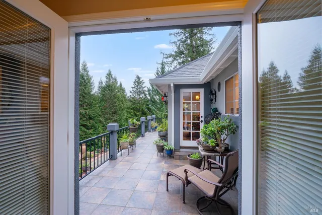 a bedroom with a bed and a ceiling fan