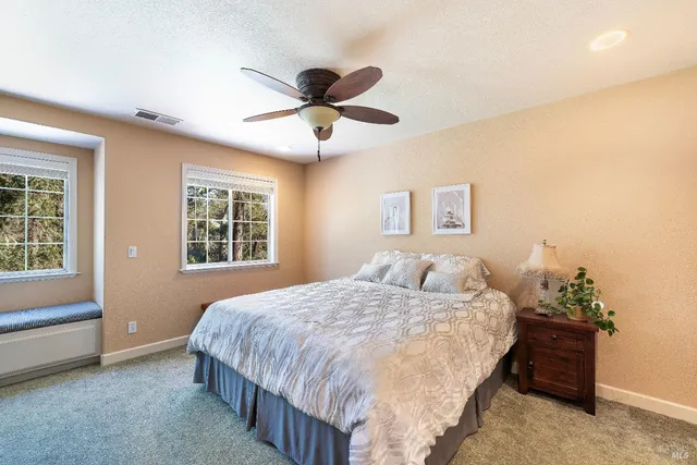 a bathroom with a shower sink and mirror
