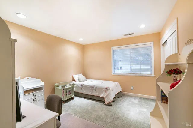 an outdoor space with seating area and trees around