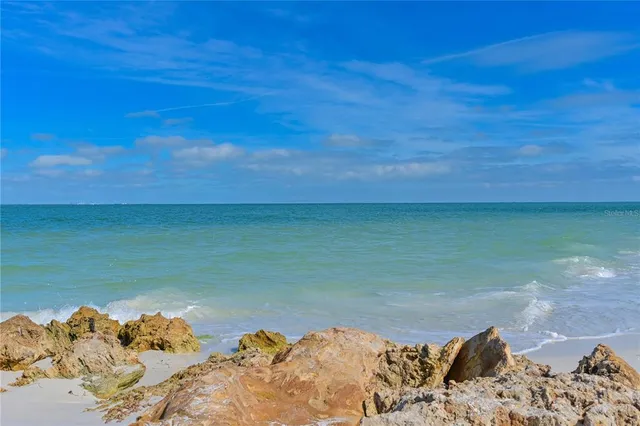 a view of a bed in a room