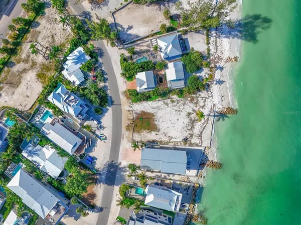 an aerial view of a house with outdoor space