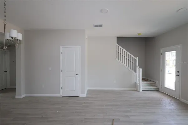 a view of entryway with wooden floor