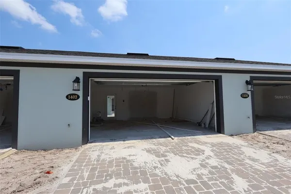 a view of a livingroom with wooden floor and a chandelier