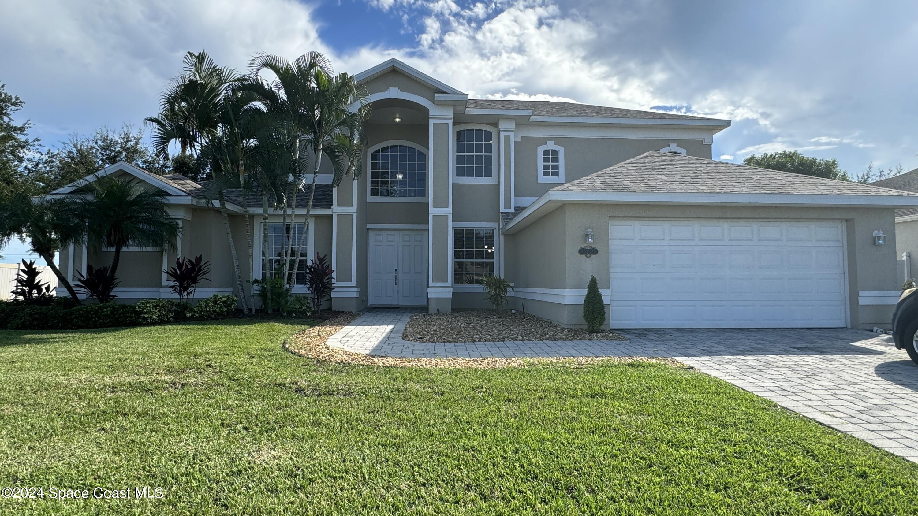 1471 Tamango Drive Melbourne, FL 32904 - Photo 1 of 23 a front view of a house with a yard