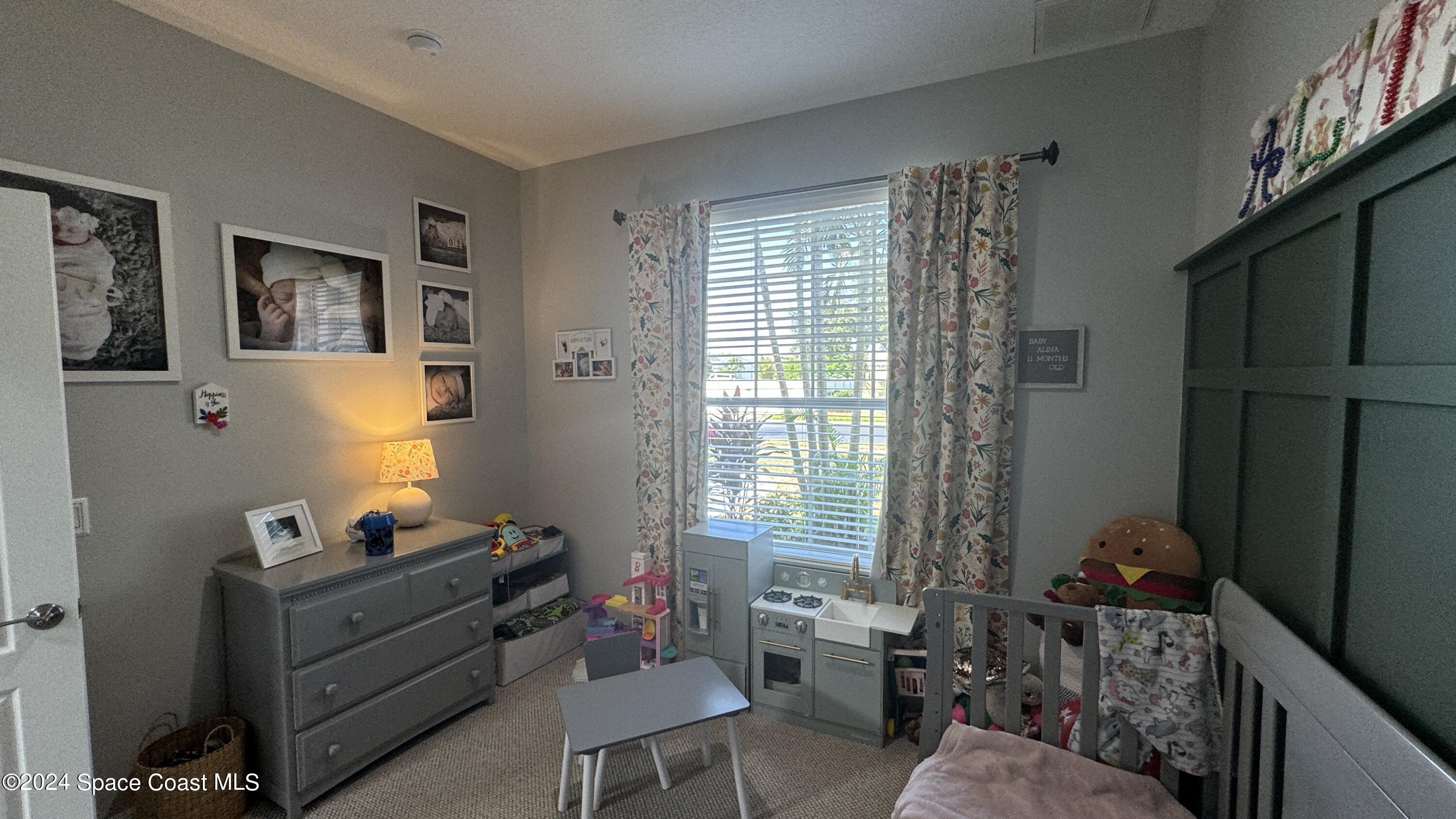 1471 Tamango Drive Melbourne, FL 32904 - Photo 13 of 23 a room with furniture and a window