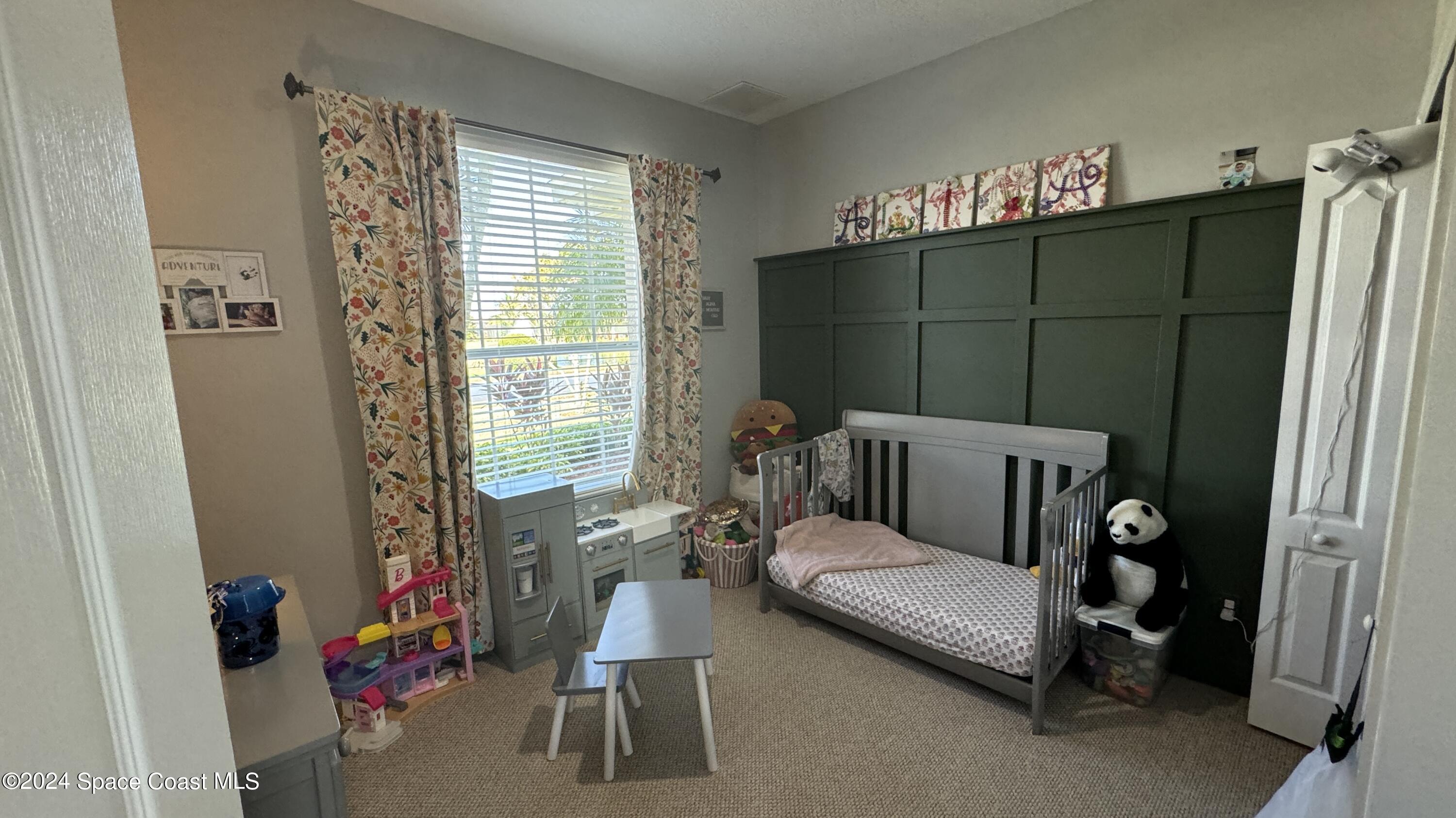 1471 Tamango Drive Melbourne, FL 32904 - Photo 14 of 23 a living room with furniture a lamp and a window