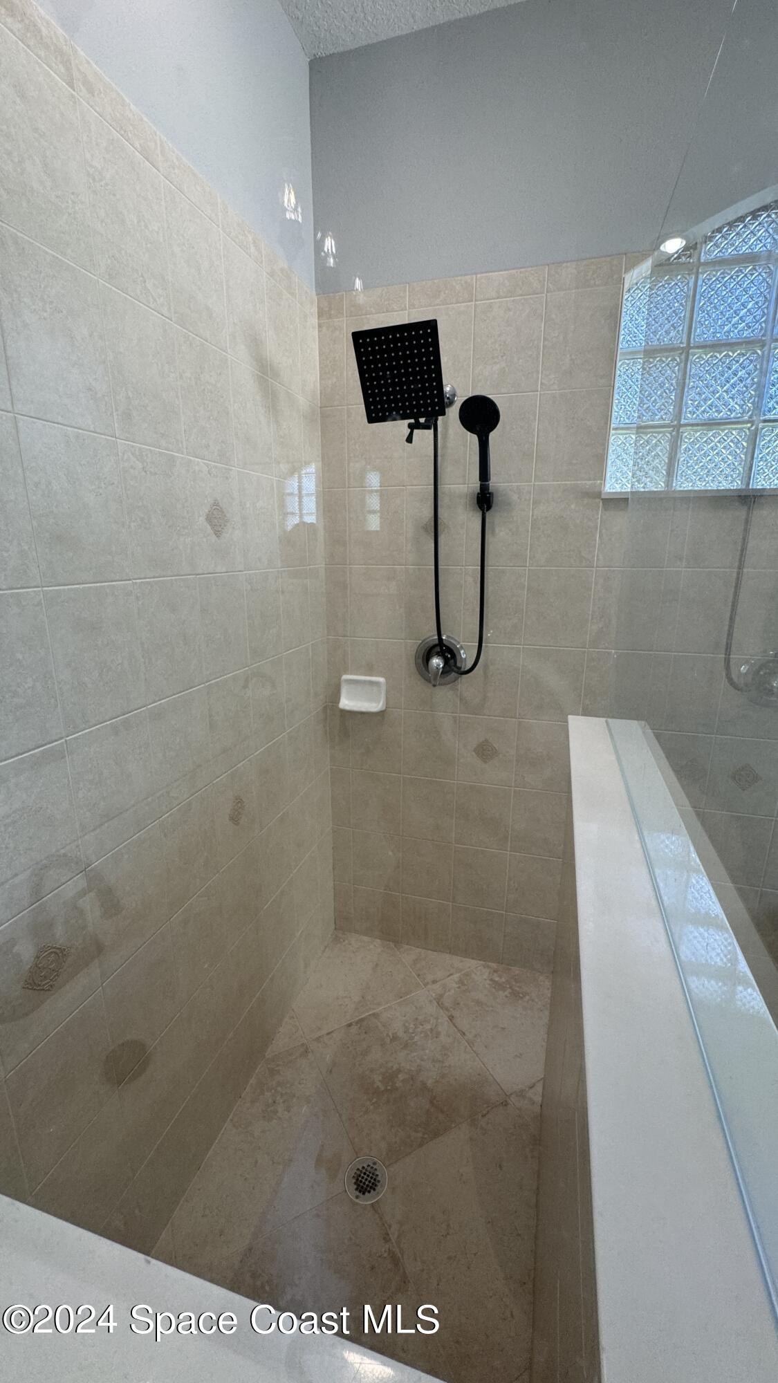 1471 Tamango Drive Melbourne, FL 32904 - Photo 15 of 23 a bathroom with a shower