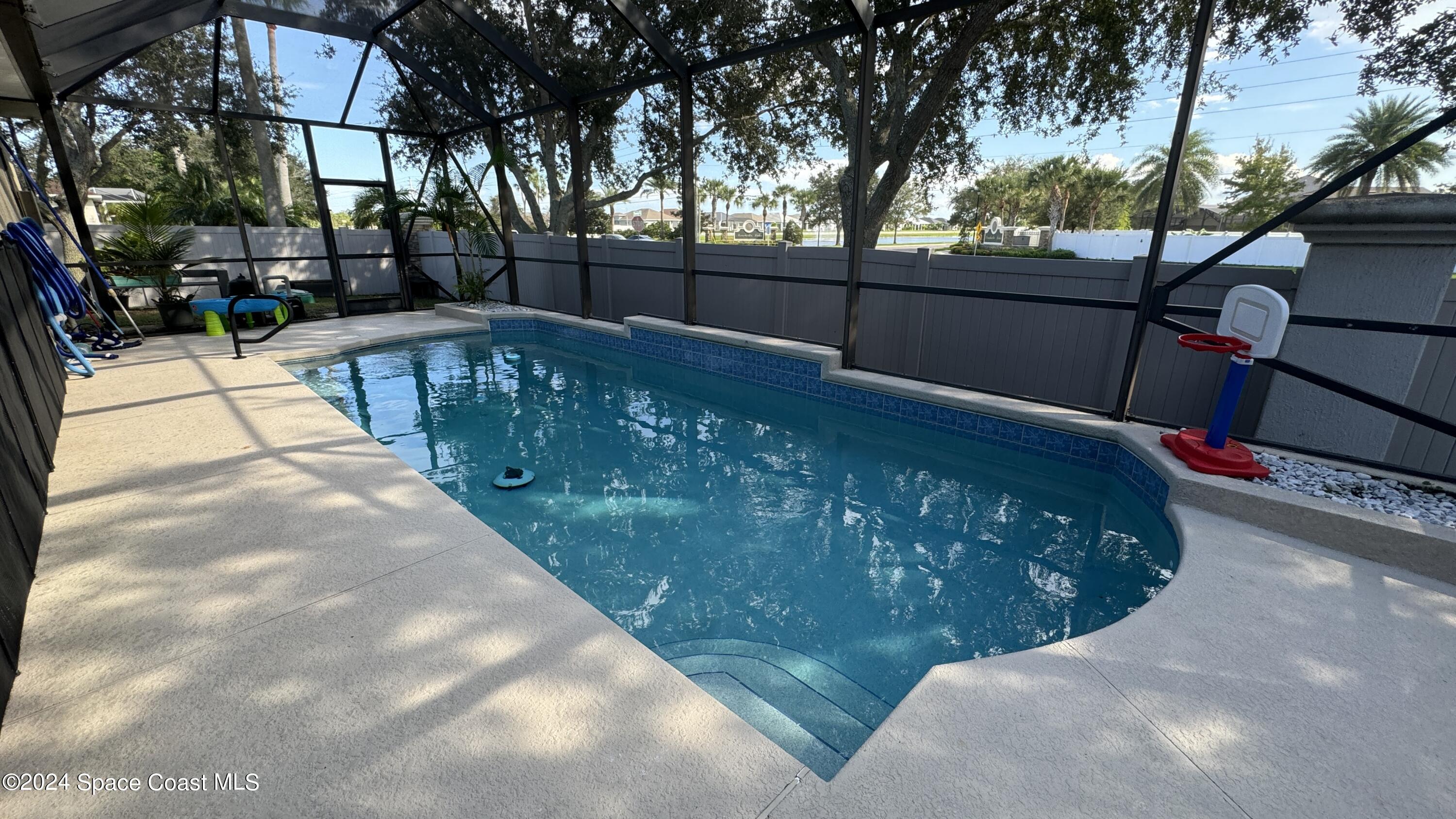 1471 Tamango Drive Melbourne, FL 32904 - Photo 2 of 23 a view of a yard with a fountain