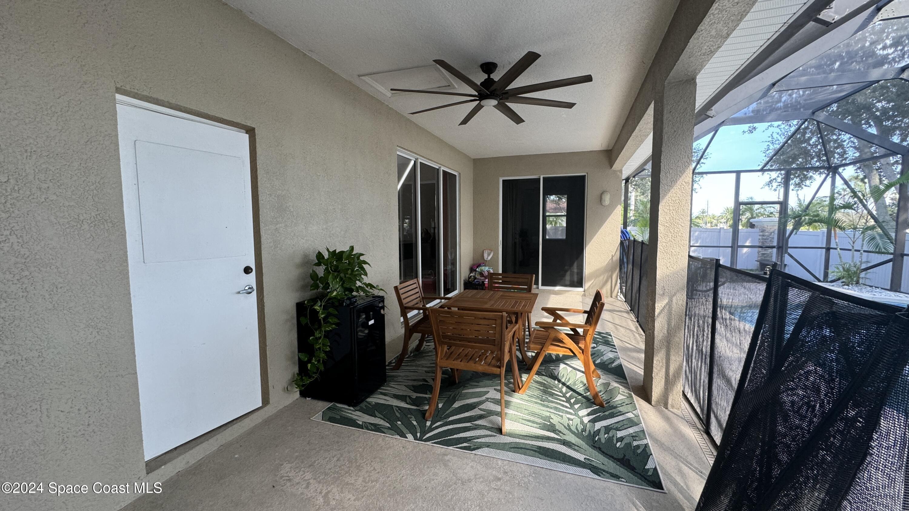 1471 Tamango Drive Melbourne, FL 32904 - Photo 3 of 23 a living room with furniture and a large window