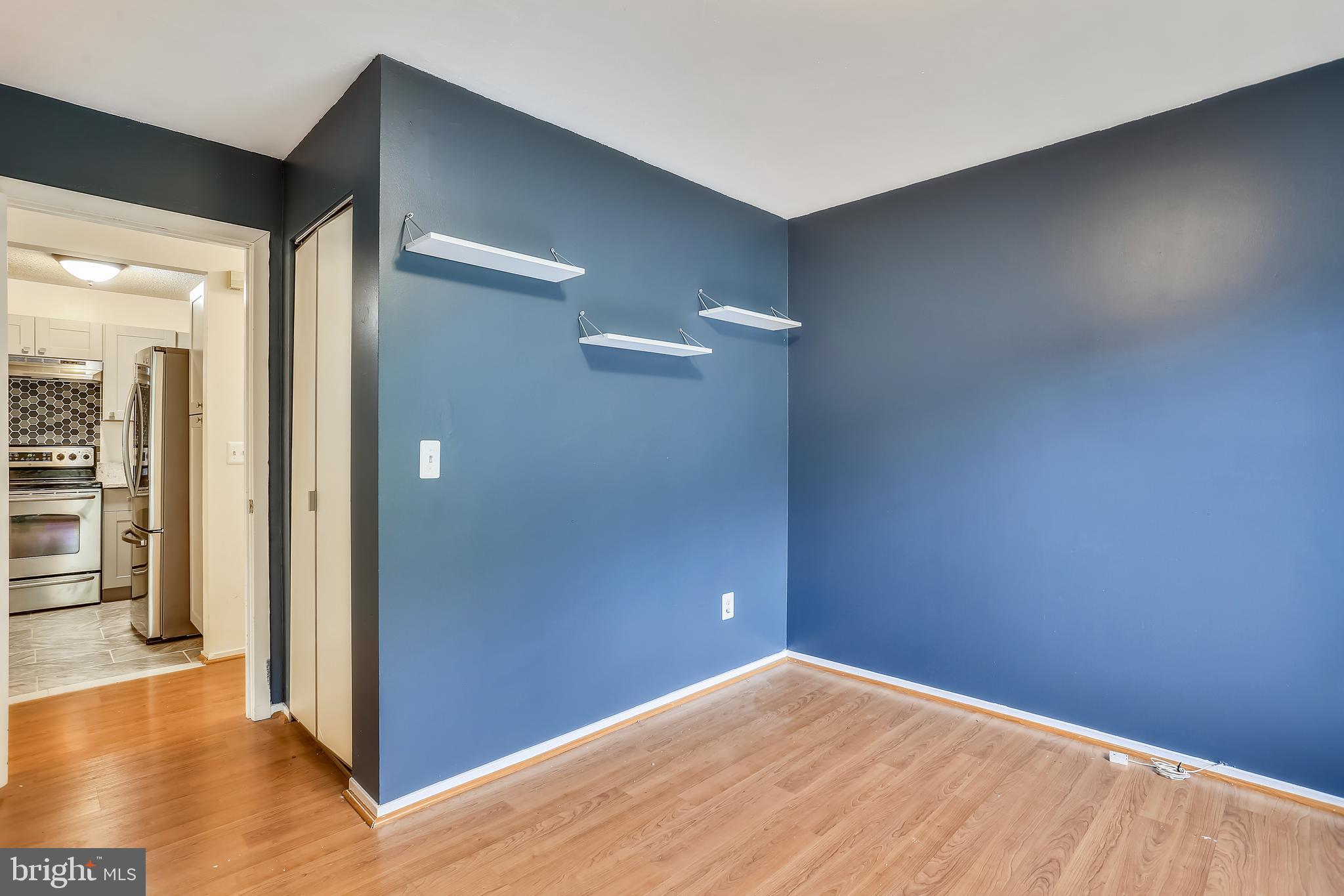 11719 E Summerchase Circle, Unit 1719E Reston, VA 20194 - Photo 15 of 26 wooden floor in an empty room