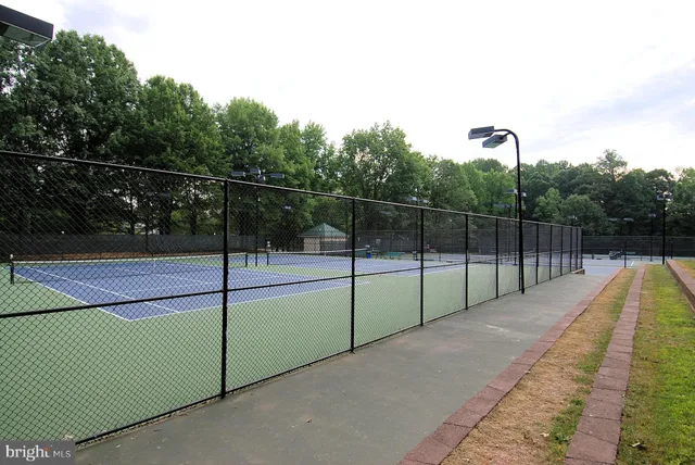 a view of a tennis court with tennis court