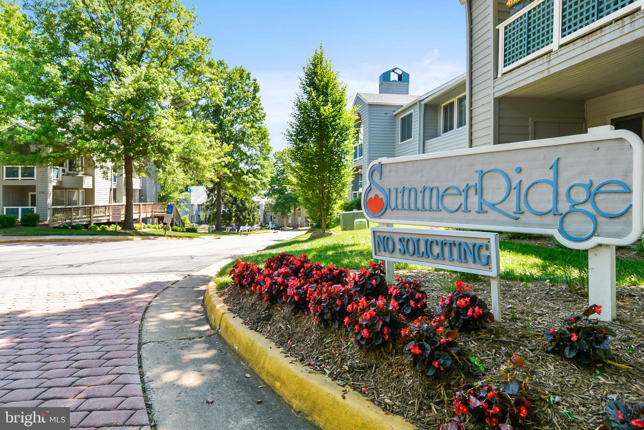 11719 E Summerchase Circle, Unit 1719E Reston, VA 20194 - Photo 24 of 26 a sign on the side of a building