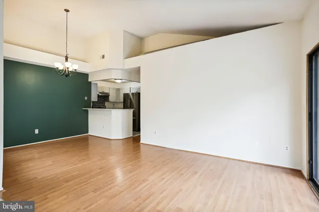 a view of a kitchen with wooden floor