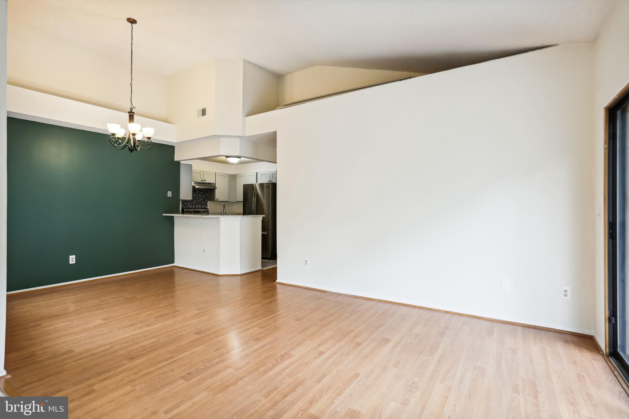 11719 E Summerchase Circle, Unit 1719E Reston, VA 20194 - Photo 6 of 26 a view of a kitchen with wooden floor