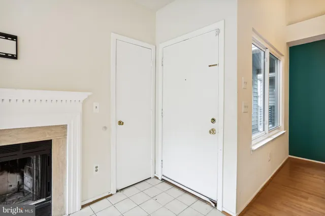 a view of a livingroom with an empty space and a fireplace