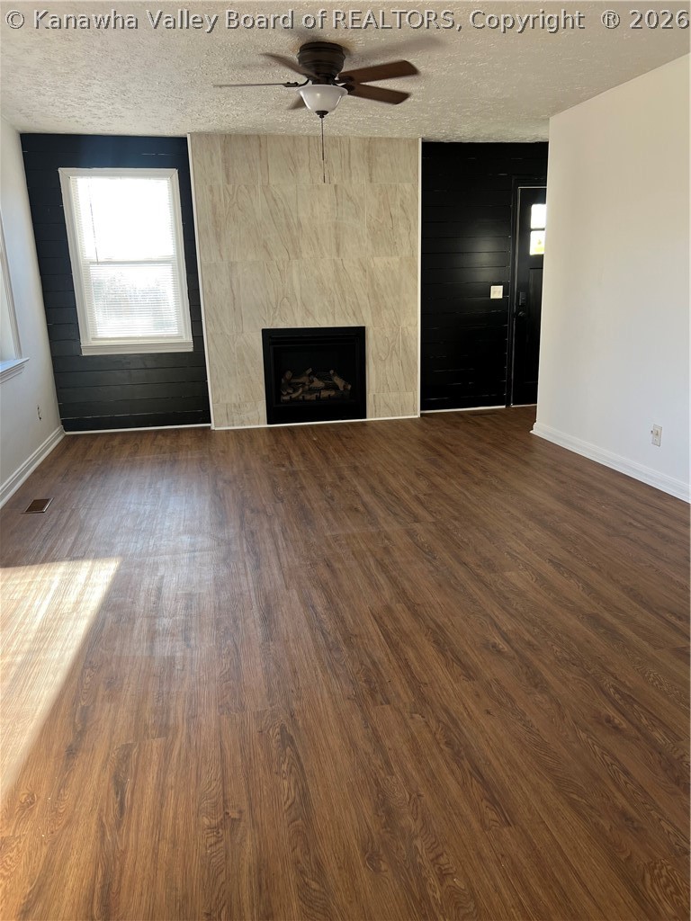 115 Ravenswood Pike Road Ripley, WV 25271 - Photo 10 of 24 Living Room w/ Gas Fireplace and New Waterproof Luxury Vinyl Plank Flooring