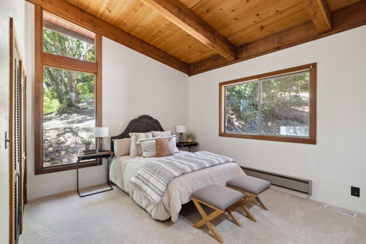 10845 Vineland Road Ben Lomond, CA 95005 - Photo 12 of 77 a bedroom with a bed and a painting on the wall