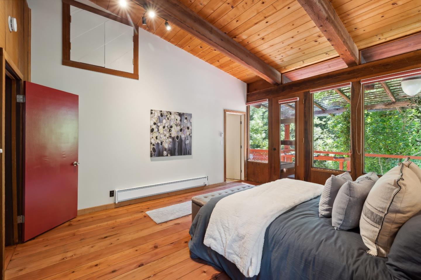 10845 Vineland Road Ben Lomond, CA 95005 - Photo 27 of 77 a bedroom with a large bed and a large window