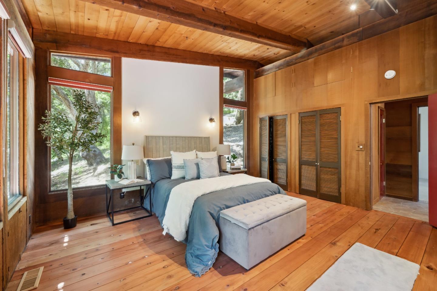 10845 Vineland Road Ben Lomond, CA 95005 - Photo 28 of 77 a spacious bedroom with a large bed and a dresser