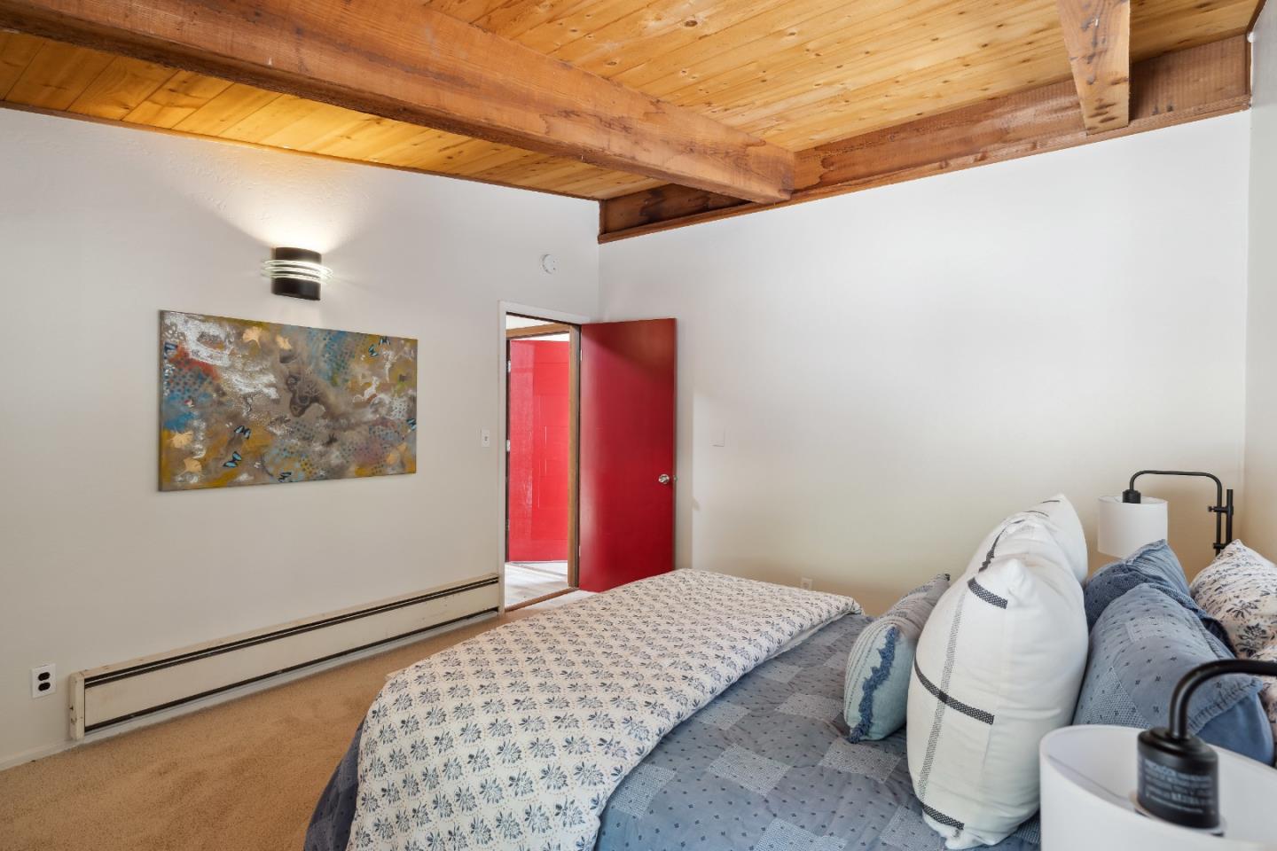 10845 Vineland Road Ben Lomond, CA 95005 - Photo 34 of 77 a bedroom with a bed and a painting on the wall