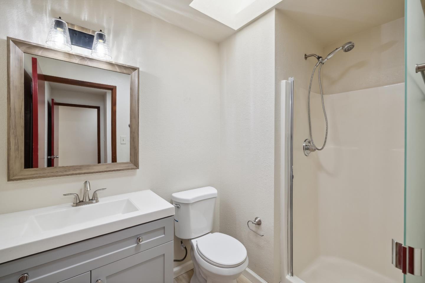 10845 Vineland Road Ben Lomond, CA 95005 - Photo 35 of 77 a bathroom with a granite countertop sink vanity mirror and toilet