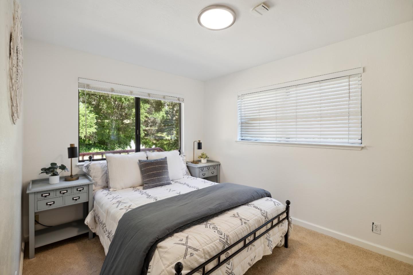 10845 Vineland Road Ben Lomond, CA 95005 - Photo 43 of 77 a bedroom with a bed and a window